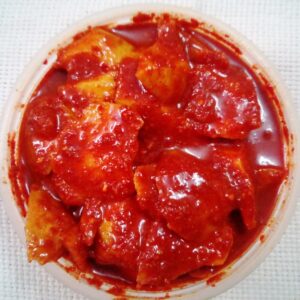 Chopped raw mango pieces coated in pickle masala