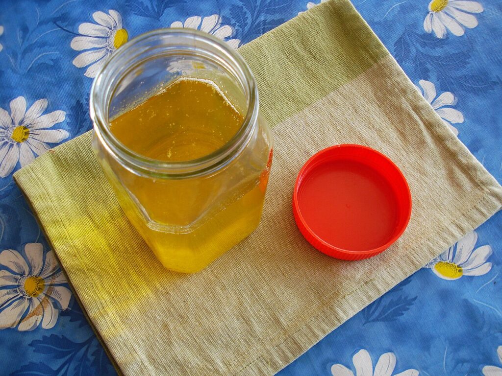Hand-churned bilona ghee being clarified, golden yellow