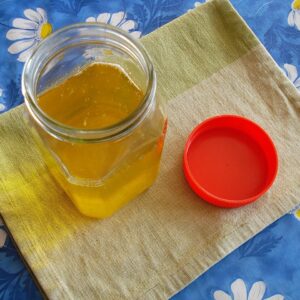 Hand-churned bilona ghee being clarified, golden yellow
