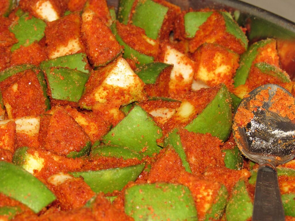 Traditional Indian mango pickle close-up in a bowl