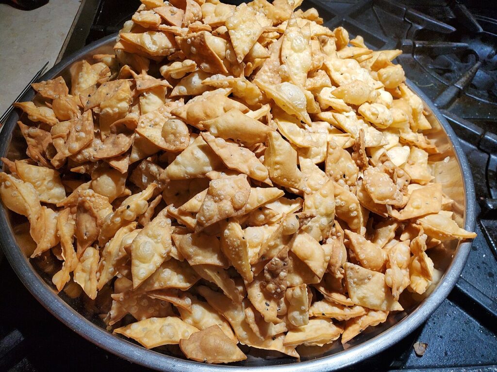 Home-fried Bihari nimki seasoned with ajwain and kalonji on a plate