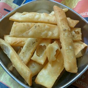 Bihari nimki namak para diamonds piled in a bowl, crisp and golden