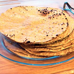 Bihari Urad Papad — stack of thin sun-dried urad dal wafers ready to roast