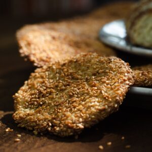 Thin flaky sesame-crusted brittle discs of authentic Sriram Gaya tilkut