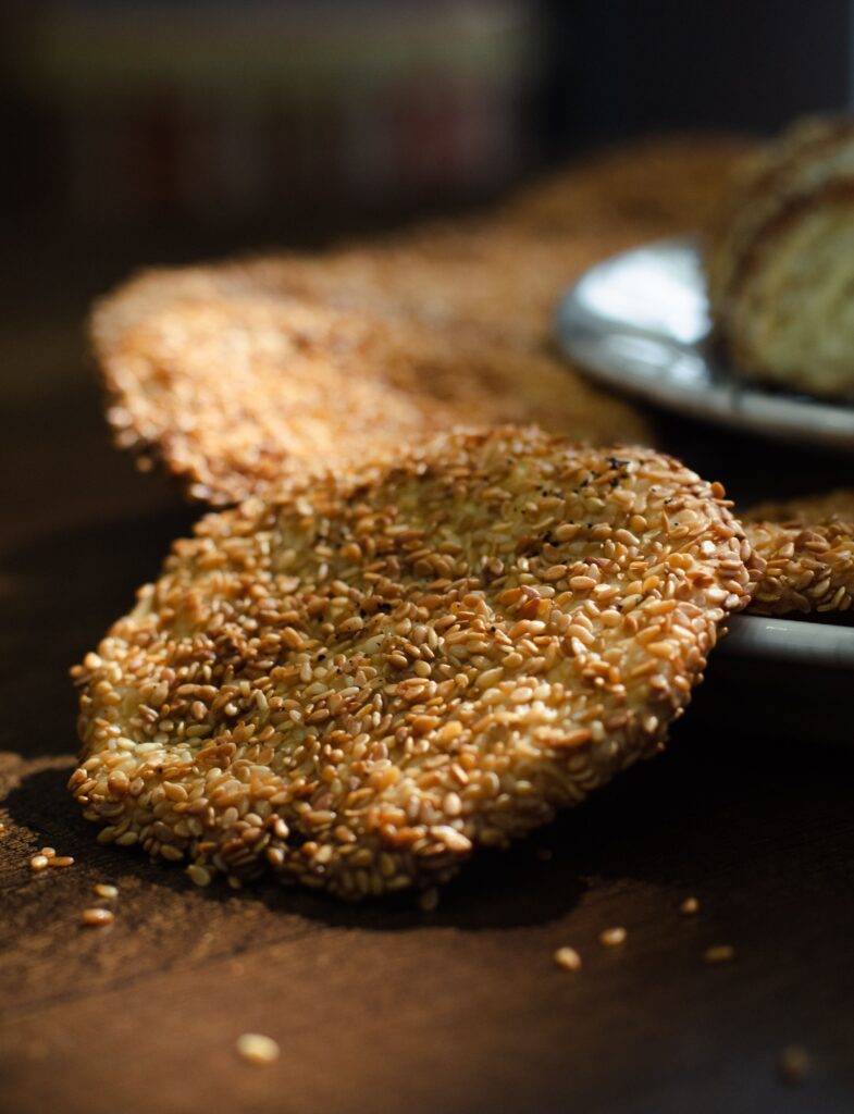 Thin flaky sesame-crusted brittle discs of authentic Sriram Gaya tilkut