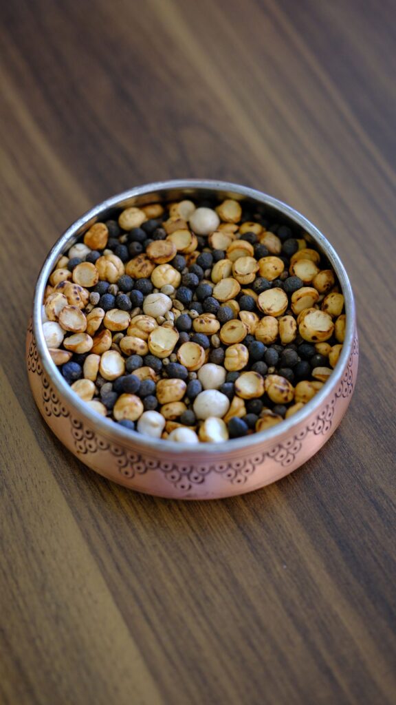 Roasted Bengal gram (bhuna chana) in a copper bowl — the toasted gram blended into Bihari chana chivda