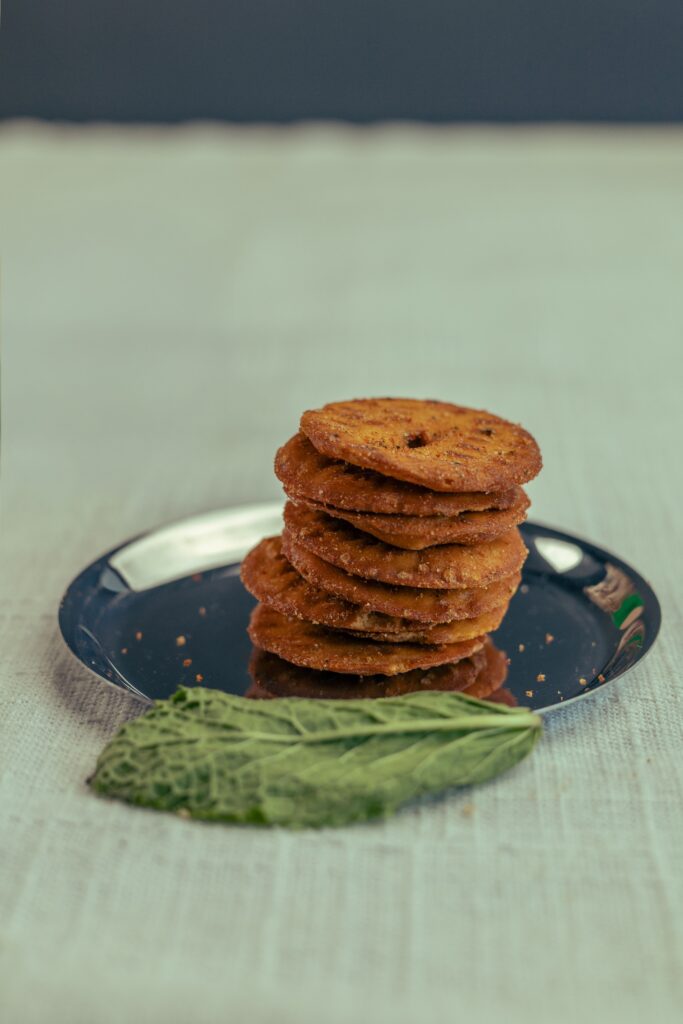 Gud Thekua - crisp golden-brown thekua discs on a plate