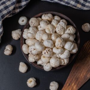 Roasted Mithila makhana fox nuts in a rustic wooden bowl