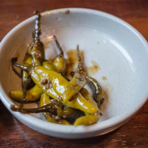 Bihari hari mirch ka achar — stuffed green chilli pickle served in a bowl